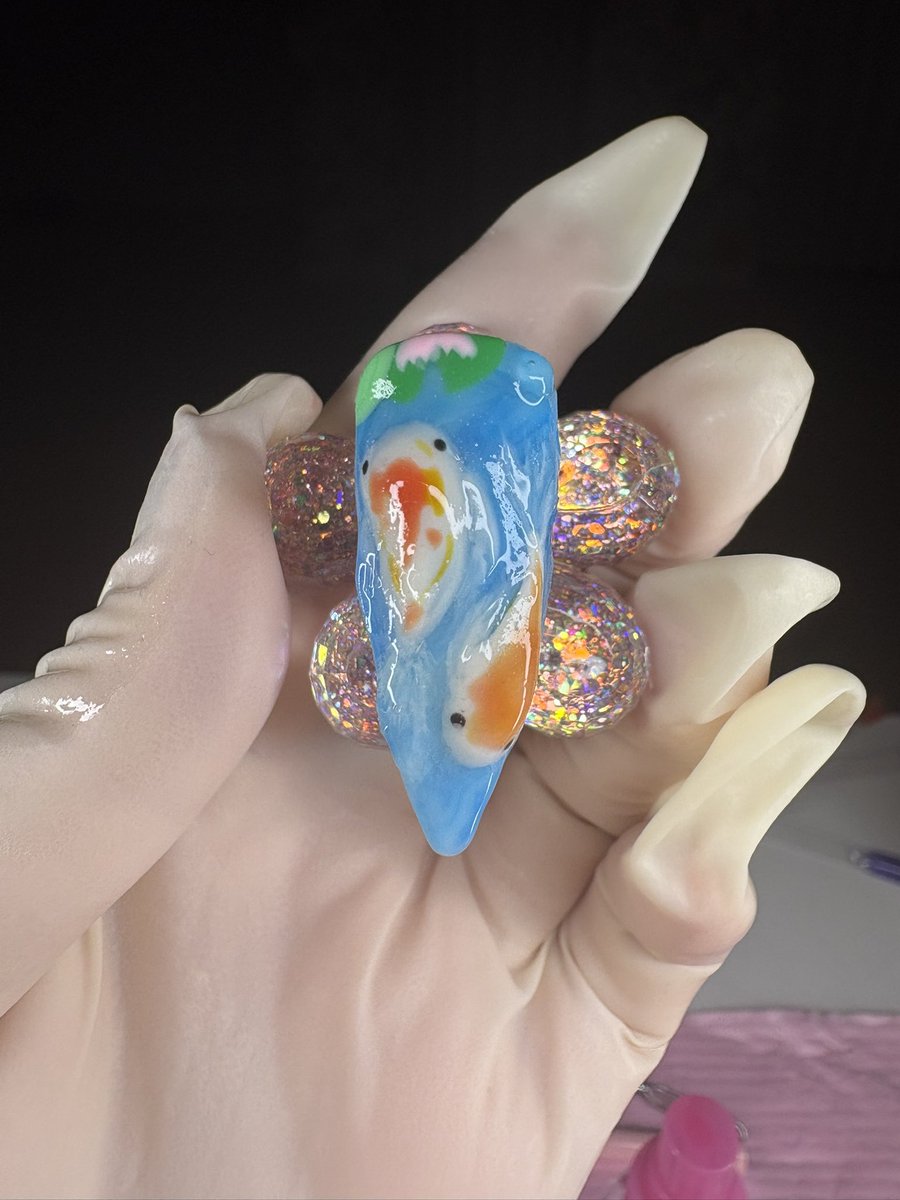 SertraKoi's tweet photo. erm don’t mind my gloves but thumb nail for a koi fish set i’m working on 🩷 #nails https://t.co/FqgmXQOCbV