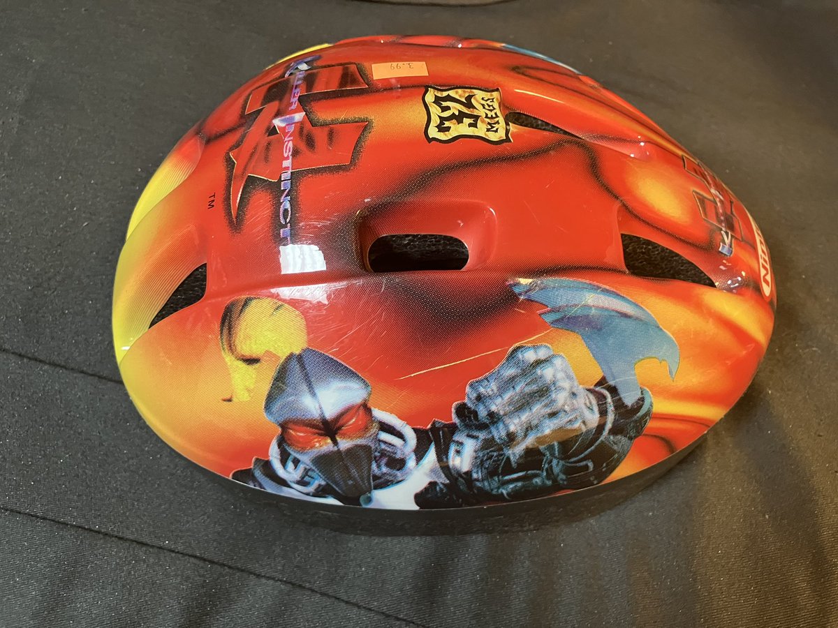 JoshGarrett1's tweet photo. @maximilian_  my friend said you might enjoy seeing this. This is a killer instinct Fulgore bicycle helmet from the Nintendo Power catalog. I found it at a local Goodwill a few weeks ago. https://t.co/asfKv4ipRy