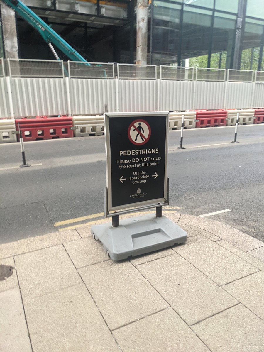 Sign that tells people to make sure they don't walk into the sign