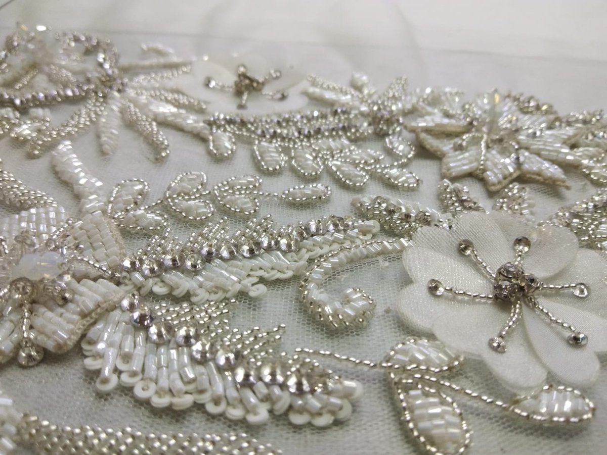 Elegant floral hand embroidery on net with sequins, beads &amp; 3D petals – perfect for bridal gowns, veils &amp; couture fashion.

Crafted by artisans at Sadul Badul, Mumbai.
Contact: info@sadulbadul.com | +91 91363 04295
Website: sadulbadul.com

#Embroidery #BridalWear