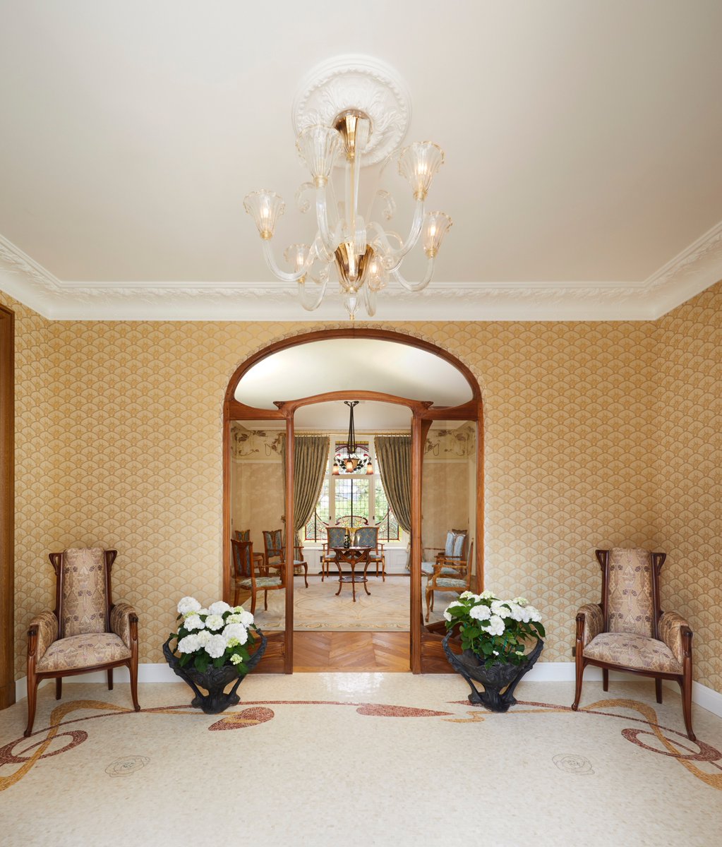 Maison Belle Epoque is home to Europe’s largest private Art Nouveau collection. This week, we’ll embark you to discover three exceptional pieces of the collection.
First, The Door Frame and Pediment by Hector Guimard. Sculpted in pear wood, this elegant work highlights the