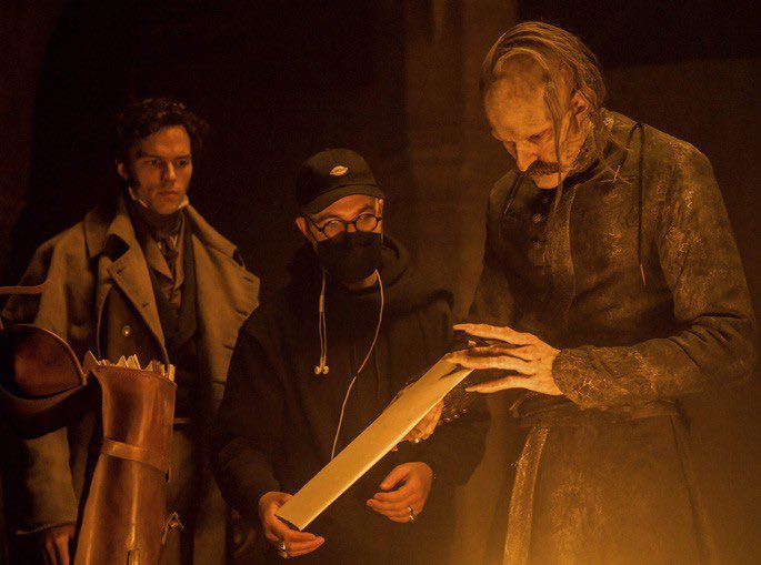 EggersFilms's tweet image. Nicholas Hoult, Bill Skarsgård and Robert Eggers on the set of Nosferatu.