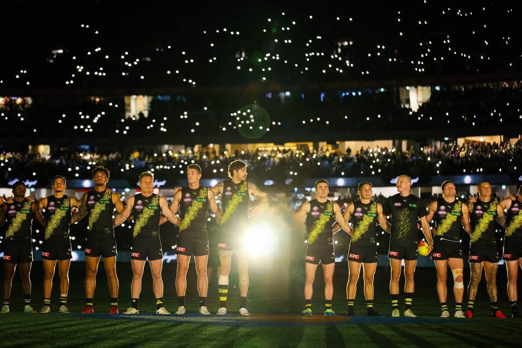 Anzac Eve idea.

When Richmond line up for the Last Post prior to the game, they should leave a gap in the middle of their lineup - which represents every Tiger player who went to War and never returned.

Symbolising our fallen teammates.
(digitally altered image below)