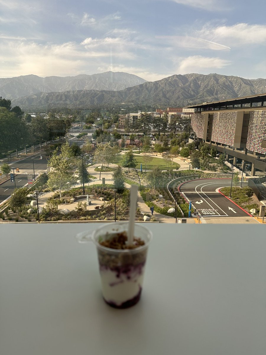 Savoring a berry parfait with a stunning view at the new City of Hope outpatient Hope Plaza— a perfect way to unwind after a long day of rounding and clinic.