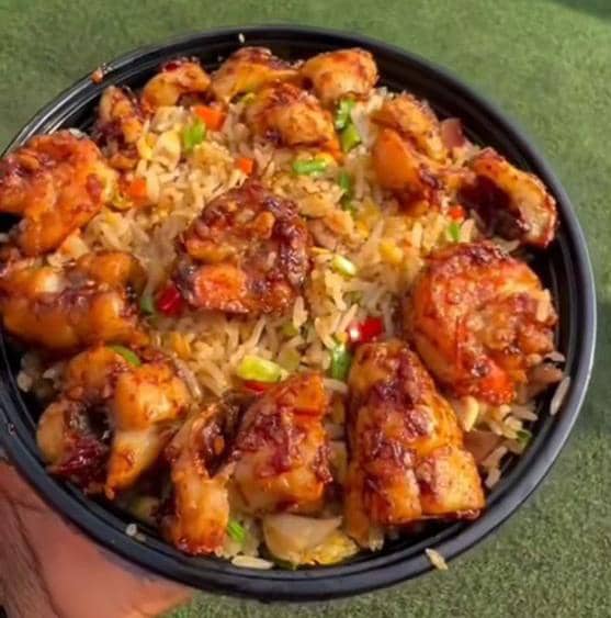 The Deluxe Special; A best seller.  Friendrice with Prawns, Calamari, Chopped Chicken &amp; Meats plus Veggies spiced with a blend of our secret spice, ginger, garlic, and others. Order now whatsapp 08136134325 or call