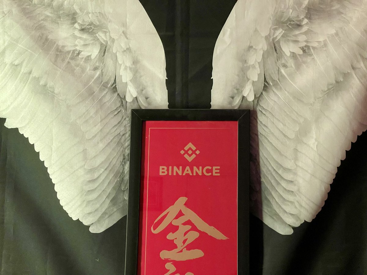 <a href="/BinanceAngels/">Binance Angels</a> I have been a passionate Binancian for years at this point, won the Chinese new year gift box in 2024 and in it was this banner that I got framed, have a tapestry with angel wings on it behind the headboard of my bed, placed one of the four framed banners behind my bed, resting