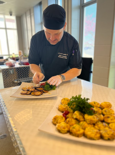 Chef extraordinaire Mark Buschle prepared authentic Spanish "tapas" for Spanish Club today. The menu featured: patatas bravas con aioli, ham croquettes, tortilla española, &amp; berenjenas fritas con miel. Club member Mylez Clark summed it up: ¡Qué rico! (Delicious!).