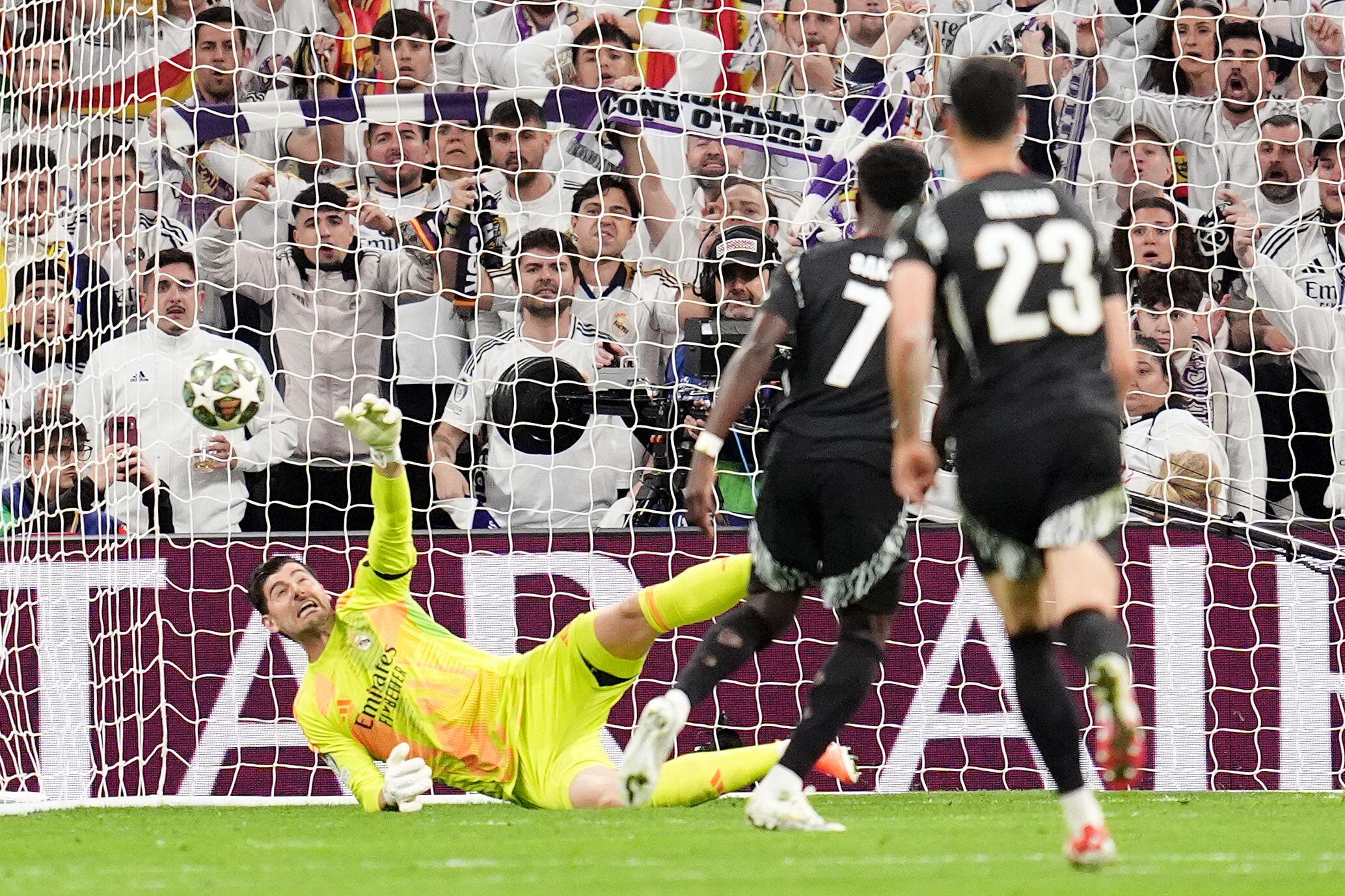 Real Madrid C.F. v Arsenal FC - UEFA Champions League 2024/25 Quarter Final Second Leg - Courtois saved Saka's penalty | sportzpoint.com