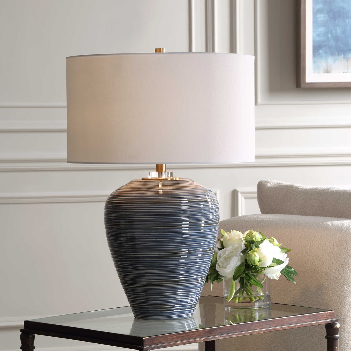 See this new #carolynkinder lamp design soon at #hpmkt in the #uttermost showroom. The organically ribbed texture is finished in a glossy blue glaze with darker blue details, complemented by plated brass accents. Moher Table Lamp - Uttermost