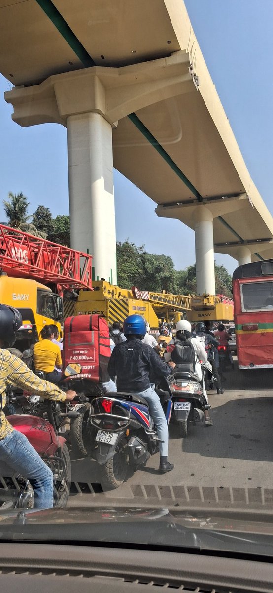 People walking on foot due to heavy traffic on ghodbunder road today.