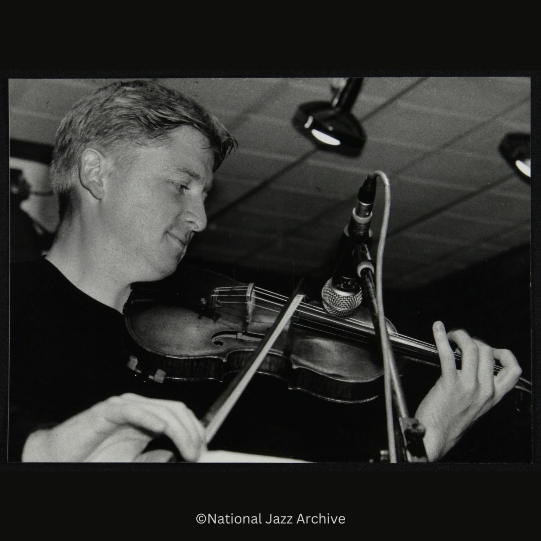Violinist Christian Garrick playing the violin at The Fairway, Hertfordshire, 23 July 2000. 

#nationaljazzarchive