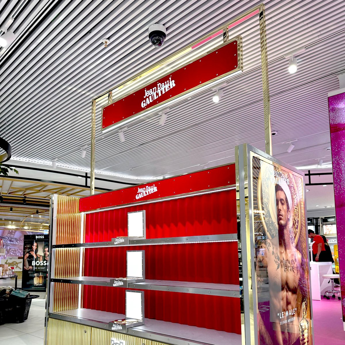 EBADER_GROUP's tweet photo. A stunning new Jean Paul Gaultier gondola has been unveiled at Terminal 4 of Madrid Airport. This premium unit features a sleek design with a newly integrated backlit logo positioned above the drawer area. 

#jeanpaulgaultier #madrid #madridairport https://t.co/VJPeTCHbPP