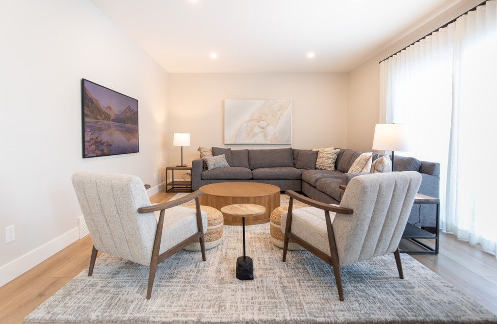 Lake Bonavista Reno - This cozy room proves that a lower level can be just as inviting as the rest of the home. Warm textures, soft lighting, and a mix of comfortable furniture turn this space into a perfect retreat.

Interior Design: <a href="/rcid_/">Rochelle Cote</a>⁠
Photo: ⁠@shellardphoto