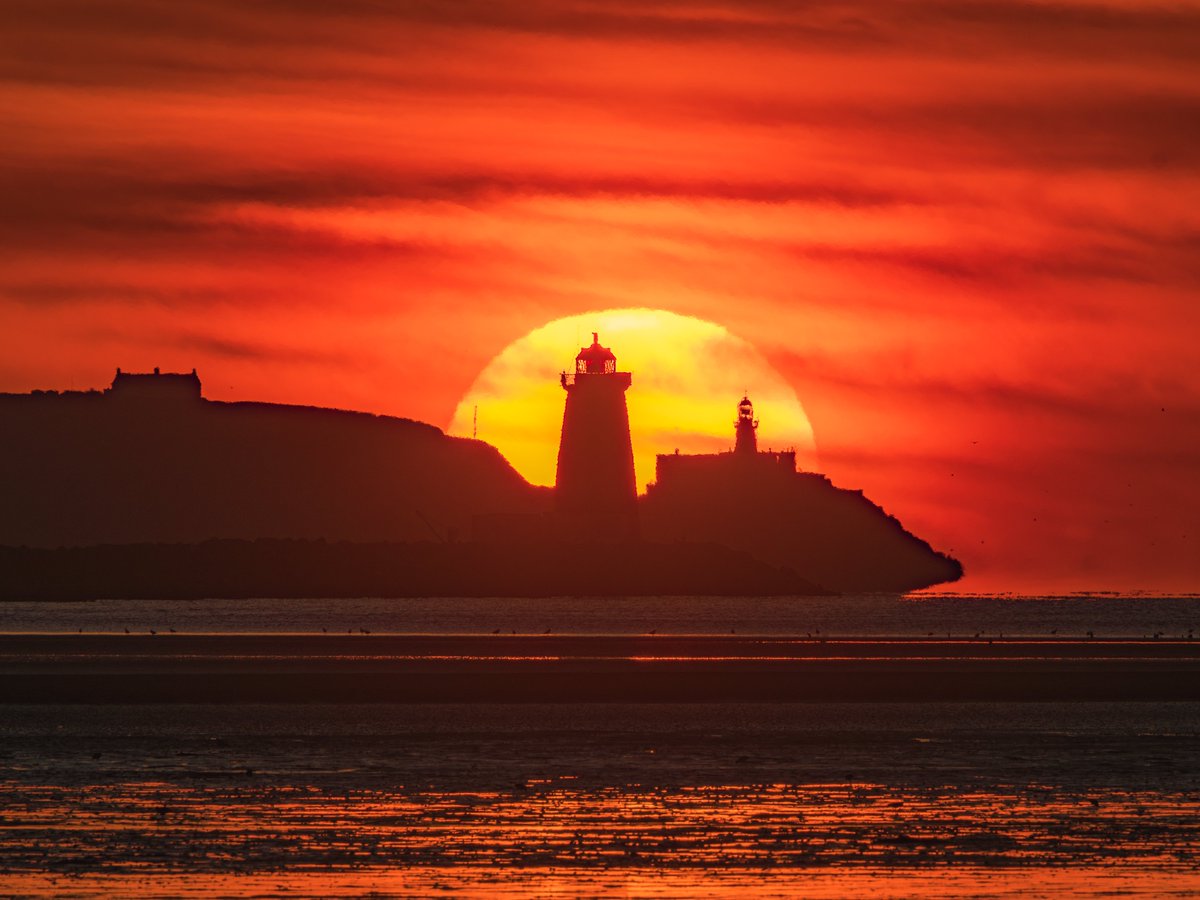 Now I've captured both the sun and moon perfectly between the Poolbeg and Baily Lighthouses. 'Tis pretty cool that it's possible to capture two great lighthouses like these in one shot. 

Moonrise is from February 2024. Sunrise is from this morning in April 2025.