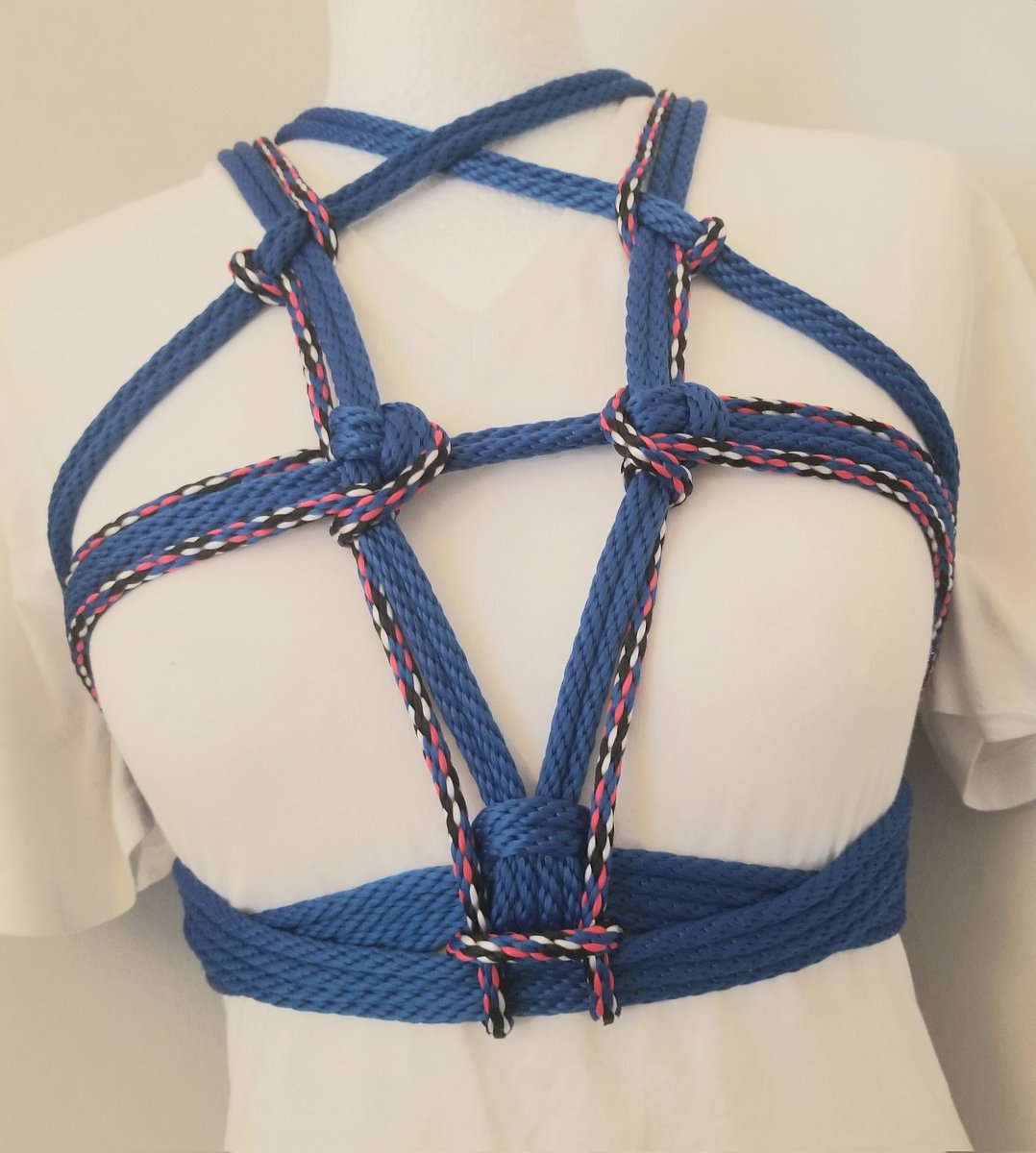 Gameguy69's tweet image. Basic shibari pentagram in Royal blue synthetic rope. Enhanced with customized waistband and secondary multicoloured rope. #shibari #MarnietheMannequin #ropework #ropeart