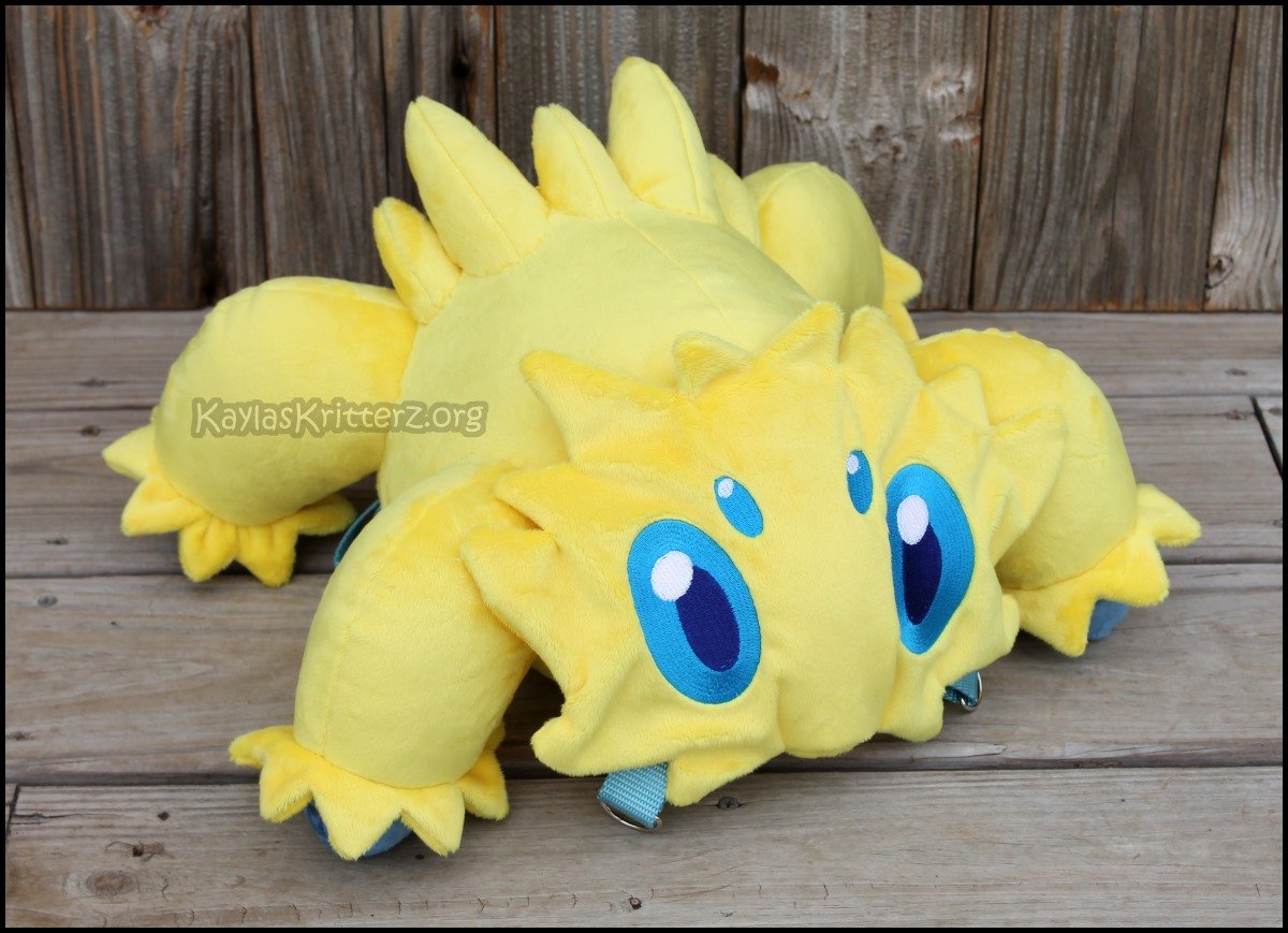For those wondering if I can do Pokemon, or have -- I sure have! I had the honor of making this cute Joltik backpack a while back for a client. I love his adorable face!