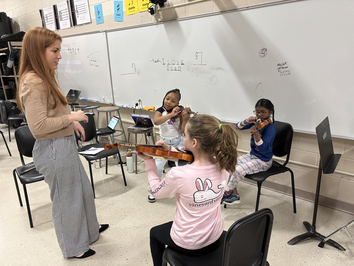 Scott Eagles holding a violin for the first time.  Chicago Symphony Orchestra violinist someday?  Why not? You never know.  Beautiful! WWDWWD.