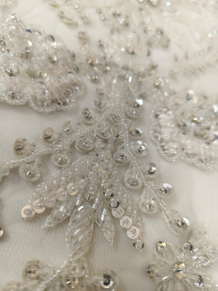 Exquisite hand embroidery with intricate detailing and elegant shimmer—perfect for bridal gowns, veils, corsets &amp; couture panels.
Handcrafted by Sadul Badul, Mumbai.

info@sadulbadul.com | +91 91363 04295
sadulbadul.com

#SadulBadul #HandEmbroidery #BridalCouture