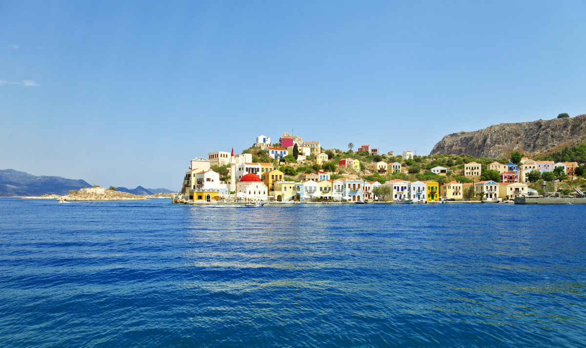 GreekMood's tweet photo. Like a painting by the sea 🎨 The colorful neoclassical houses of Kastellorizo glow under the Mediterranean sun at Greece’s edge.

#Kastellorizo #Megisti #GreekIslands #ColorfulGreece #Dodecanese #MediterraneanGem #SeasideCharm #TravelGreece #HiddenGreece #IslandBeauty https://t.co/bpJw81YllW