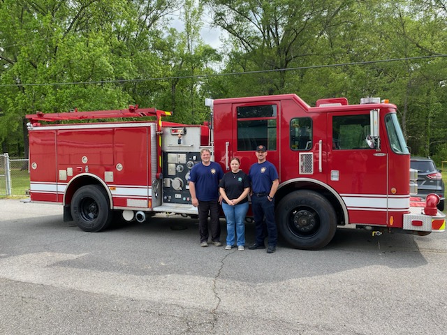 The Tontitown Fire Department in Benton County recently received a 2001 Pierce Pumper Firetruck from the Rural Fire Protection Program.

Pictured (L-R): Fire Chief Ryan Krug, RFP Administrator Kathryn Mahan-Hooten, and Fire Captain Nick Ardemagni.