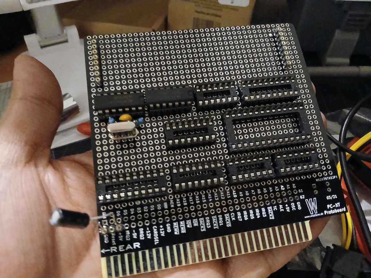 nanochess's tweet image. The sockets are now soldered. I decided to start with the oscillator, and I made one with a 10mhz crystal and divided with 74LS74. The capacitor between inverters was 10pf so it failed, it must be 0.1uf. I&apos;m pretty happy to have the required 5 mhz. #retro #transputer