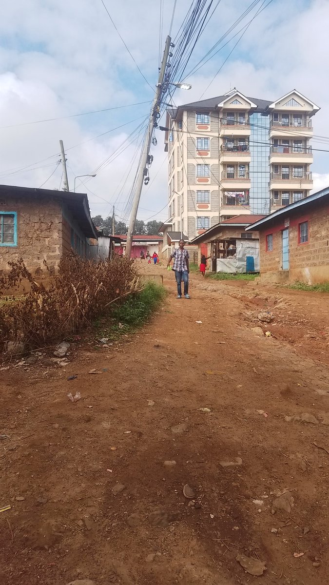 A glaring danger in Biafra Estate, Thika. An electric pole overloaded with VGG and Safaricom cables is at the verge of falling down. Kenya power, kindly move with speed. <a href="/KenyaPower_Care/">Kenya Power</a> <a href="/SafaricomPLC/">Safaricom PLC</a>