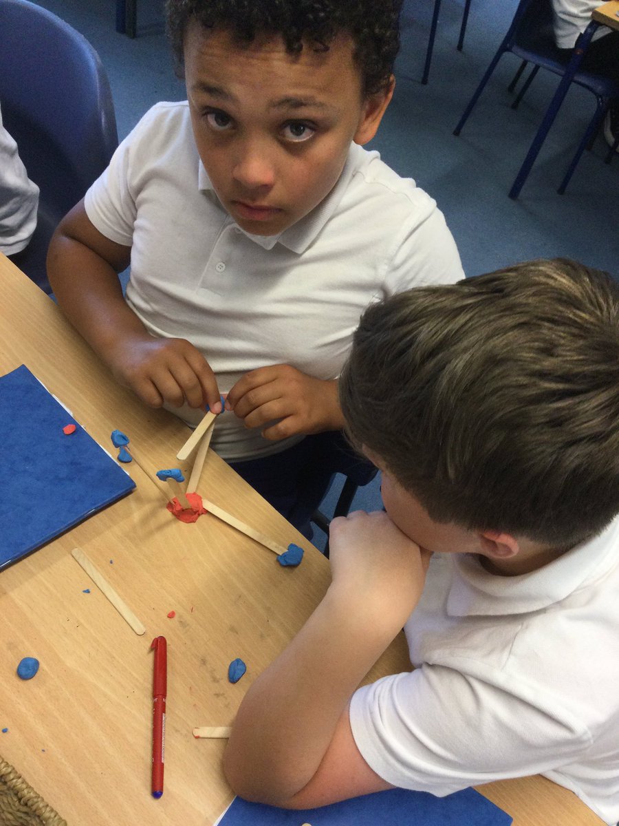 Dosbarth 9 maths class making some 3D shapes with sticks and clay