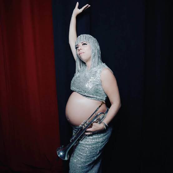 ourhermitage's tweet photo. Beyoncé's trumpeter, Crystal Torres,  who was pregnant on the Renaissance Tour made a post on IG celebrating being on the Cowboy Carter Tour,  and thanking Beyoncé for giving space to mothers like her! 

How cute is her baby? What a full circle moment 

(IG/ crystaltheindigo) https://t.co/pDJiJVr58i