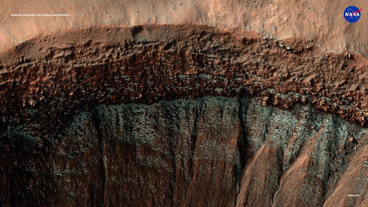 NASAScienceAA's tweet image. This month in #NASAScience, we’re zeroing in on Mars — our next giant leap. 

This image shows a striking Martian crater dusted with icy blue frost near its rim. Captured by the @NASAMars Reconnaissance Orbiter, this image offers a vivid glimpse into the dynamic and frozen…
