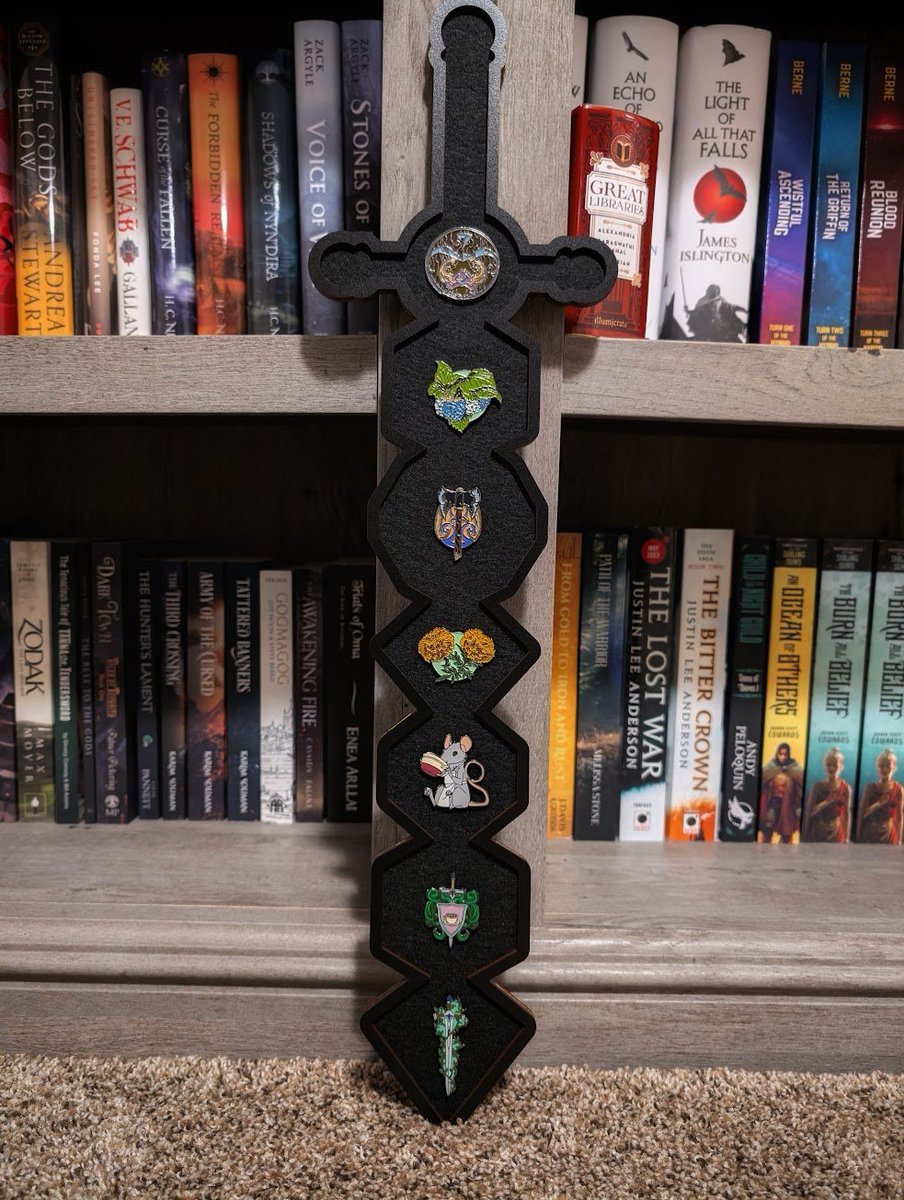 I've been so incredibly blessed ever since becoming part of the book community, honestly in more ways than I can say! Not long ago, two of my bookish friends surprised me with this amazing polyhedral sword pin display.

Knowing the loving thought behind their surprise, it feels