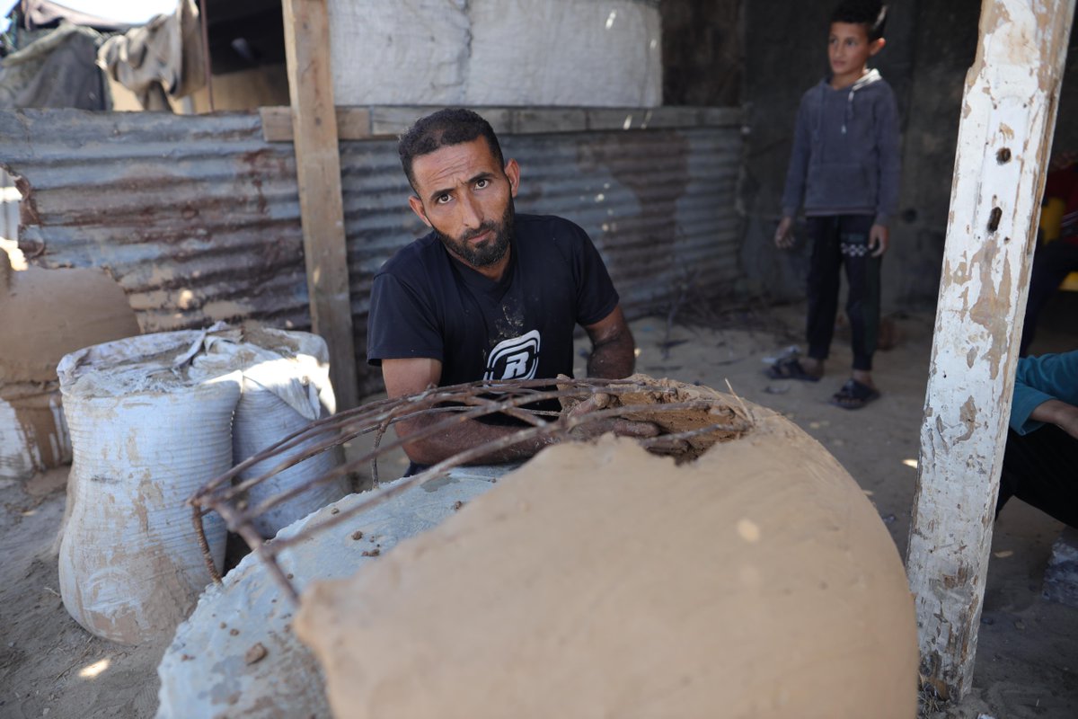 WCKitchen's tweet photo. “The lunch meal from WCK is the only meal I have all day,” said Ali, an artisan who builds traditional clay ovens by hand. With no gas or electricity, displaced families rely on ovens like his to cook. WCK meals fuel Ali’s work, helping him support his community. #ChefsForGaza https://t.co/j0G3gVoQeb