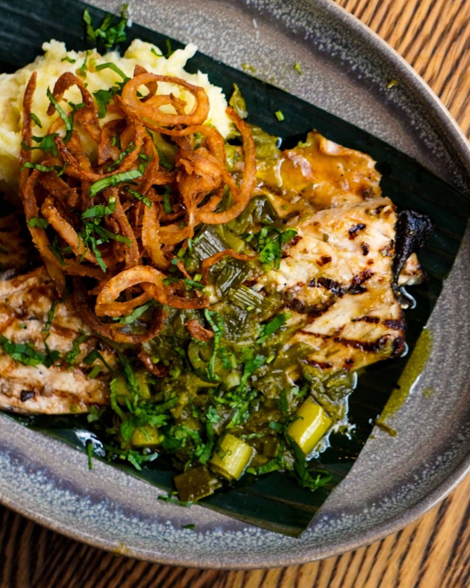 Grilled to perfection. Every time.

Pescado en Mojo de Ajo Verde |  Riverence trout in local green garlic mojo, roasted poblanos, queso añejo mashed potatoes, crispy onions