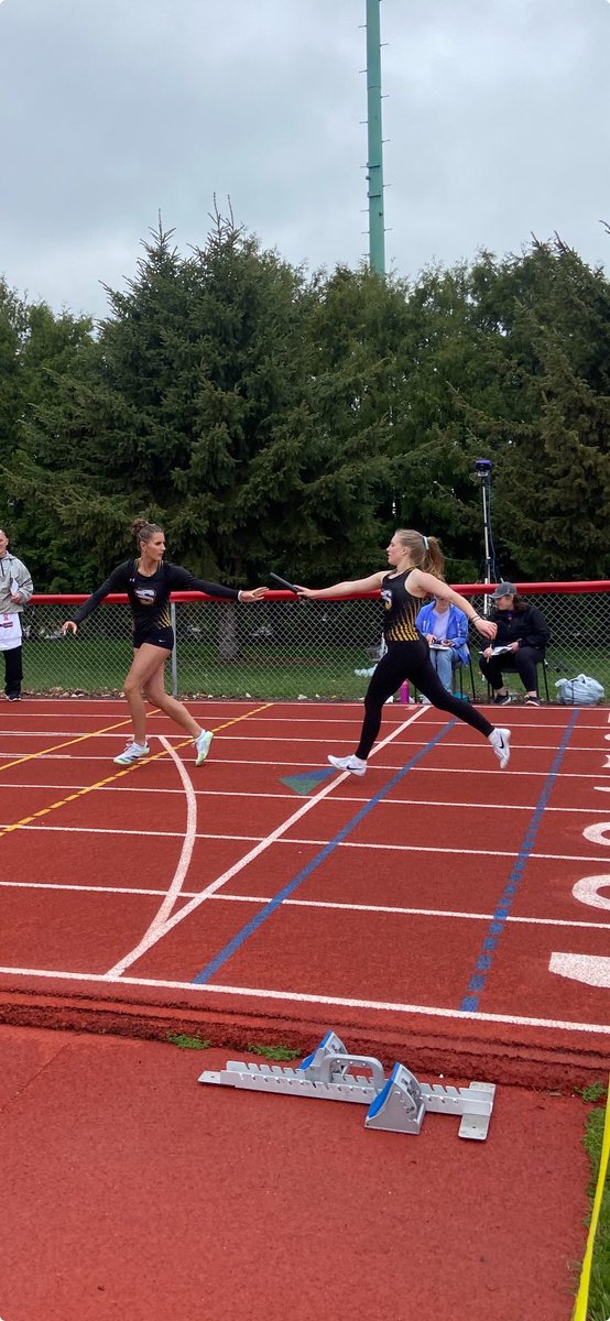 SaydelGTrack's tweet photo. Stella White handing off to Luella Weispfenning for the spring medley relay in Boone! https://t.co/x0qgKAd9us