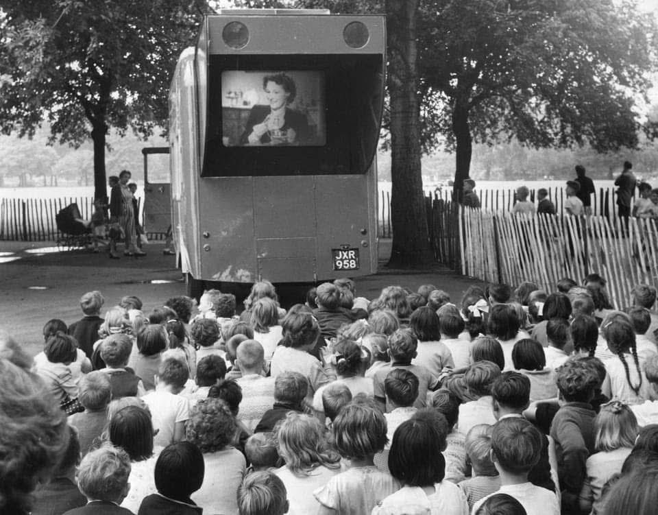 Children watching an open-air cinema show in Clissold Park in 1957.