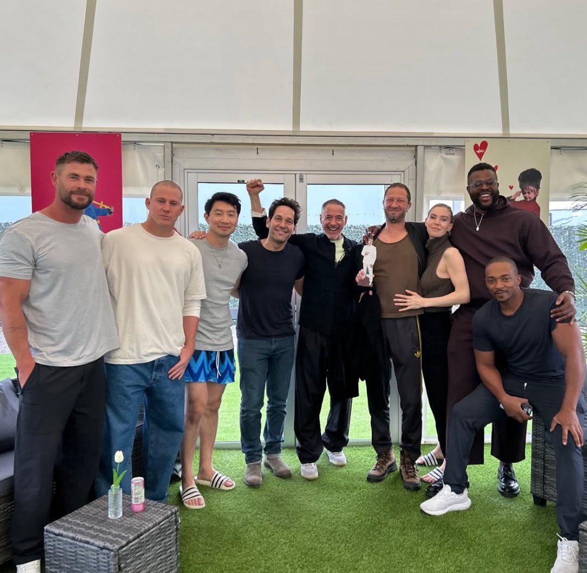 Chris Hemsworth with ‘AVENGERS: DOOMSDAY’ cast mates Channing Tatum, Simu Liu, Paul Rudd, Robert Downey Jr., (standee) Pedro Pascal, Ebon Moss-Bachrach, Vanessa Kirby, Winston Duke, and Anthony Mackie.

Now in production. In theaters May 1, 2026.