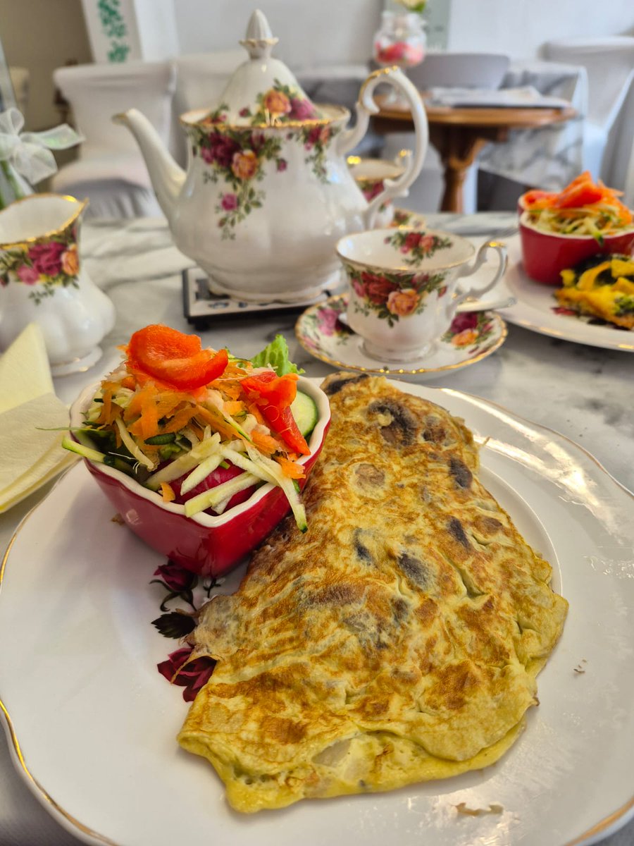 Adele took this photo of her food today. Mushroom and onion omelette with salad.