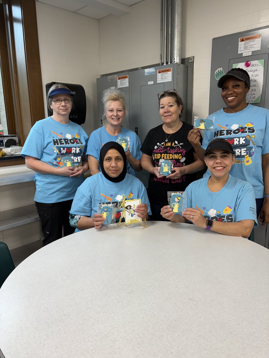 Who feeds hundreds of kids every day during the school year? This team of School Lunch Heroes! Today is School Lunch Hero Day and we are celebrating them with special decorated cookies and t-shirts.