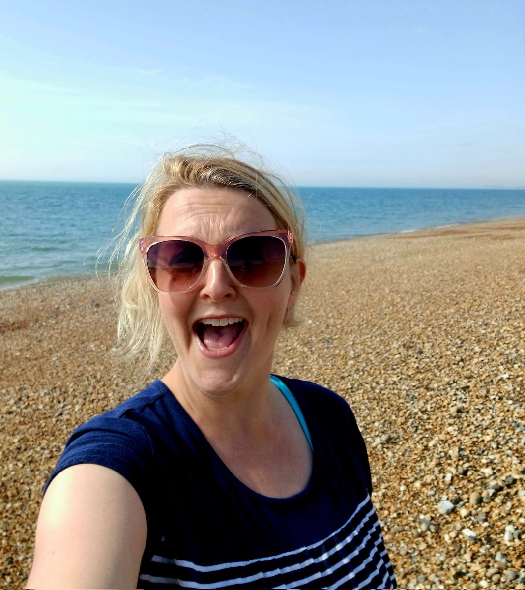 This is the face of an author who hit send on something big this week, and then scampered off to eat croissants and swim in the sea