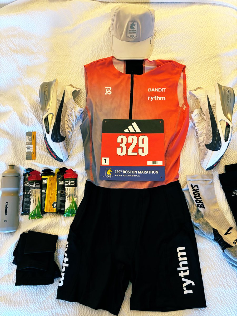 Boston 2025 kit lay. 

I wasn’t messing around about bringing the speed suit to the marathon.
