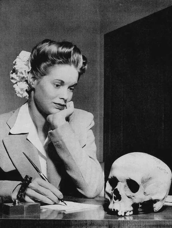 A young woman writing a thank you note to her boyfriend in the Navy for the skull of a Japanese soldier that he sent, 1944.