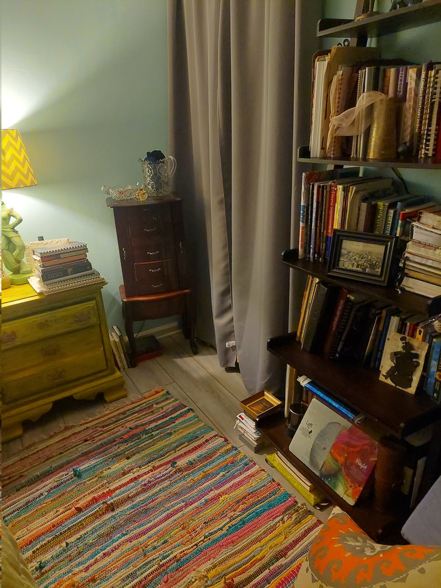 My bedside. I'm always trying to read many books at once. I finish most of them. In contrast, see my wife's bedside. I wonder if I can talk her into switching sides so I can have a bookshelf.