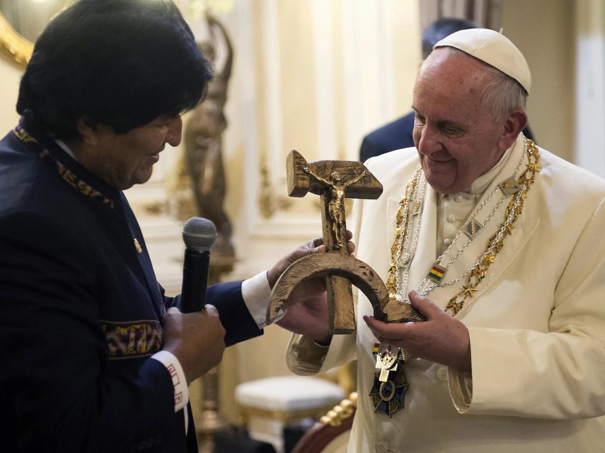 Here's Pope Francis cheerfully receiving a replica gift of the hammer-and-sickle crucifix made by Fr. Luis Espinal, a human-rights activist who was killed by a paramilitary death squad in 1980. 

A remembrance that we once had a Pope who saw Jesus the Carpenter—Christ the Worker.