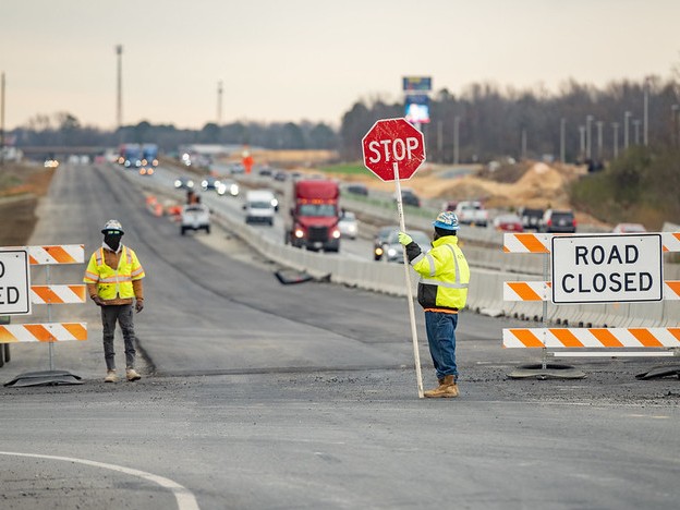 NCDOT's tweet photo. See barrels? Flaggers? Train your brain to slow down and stay alert.
Work zones can be unpredictable. 

🚧 ℝ𝕖𝕤𝕡𝕖𝕔𝕥 𝕥𝕙𝕖 Z𝕠𝕟𝕖 S𝕠 W𝕖 A𝕝𝕝 G𝕖𝕥 H𝕠𝕞𝕖.

#NWZAW #ATSSA https://t.co/SEFp40YFvl