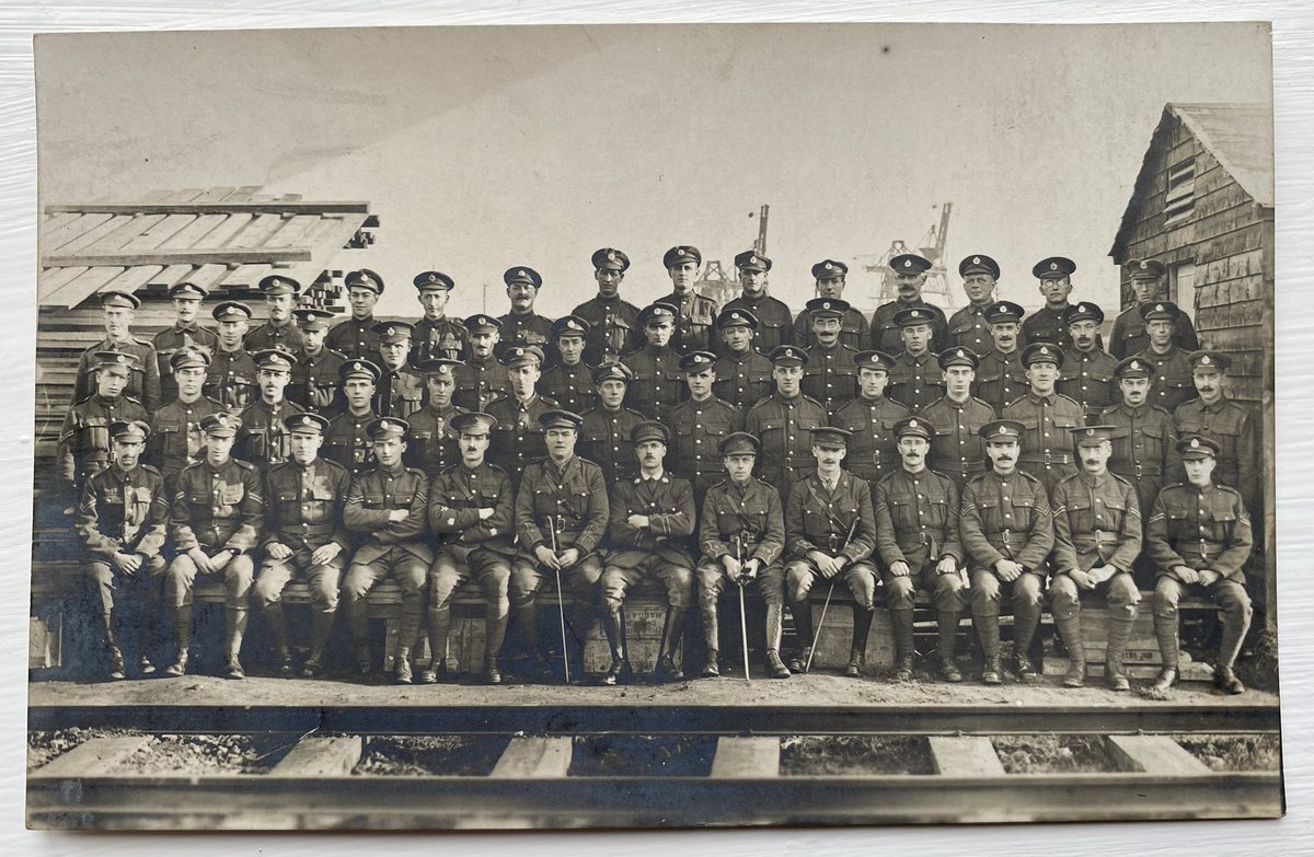 ypreswoman's tweet image. New postcard: looks like a railway depot possibly Audruicq - note cranes in background 
Anyone help with the cap badges of the officers
#Railway #WW1