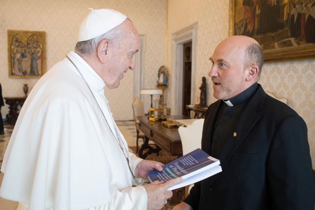 May Pope Francis (1936–2025) rest in the peace of Christ.

In this picture, he is talking with Gabriele Gionti, a Jesuit scientist from the Vatican Observatory. The book he is holding is Foundations of Physics.
