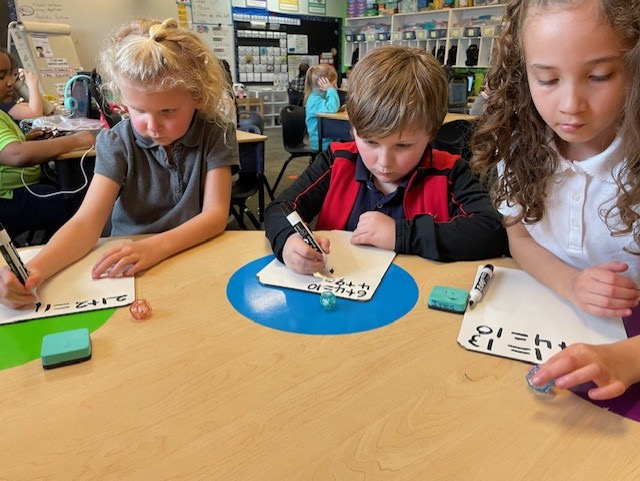 SouthCantonSCA's tweet photo. Ms. Burnham’s first graders love building their foundational math skills in fun and engaging ways! During workshop students strengthen their understanding of numbers while developing confidence in their math skills. https://t.co/aG56b8nkom