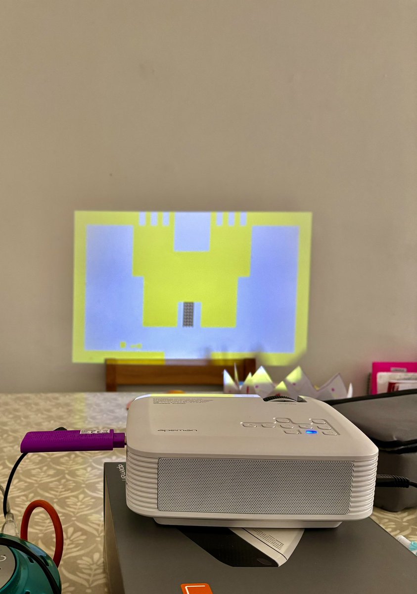 Broke out mini projector and plugged in game stick, played Atari Adventure with daughter.