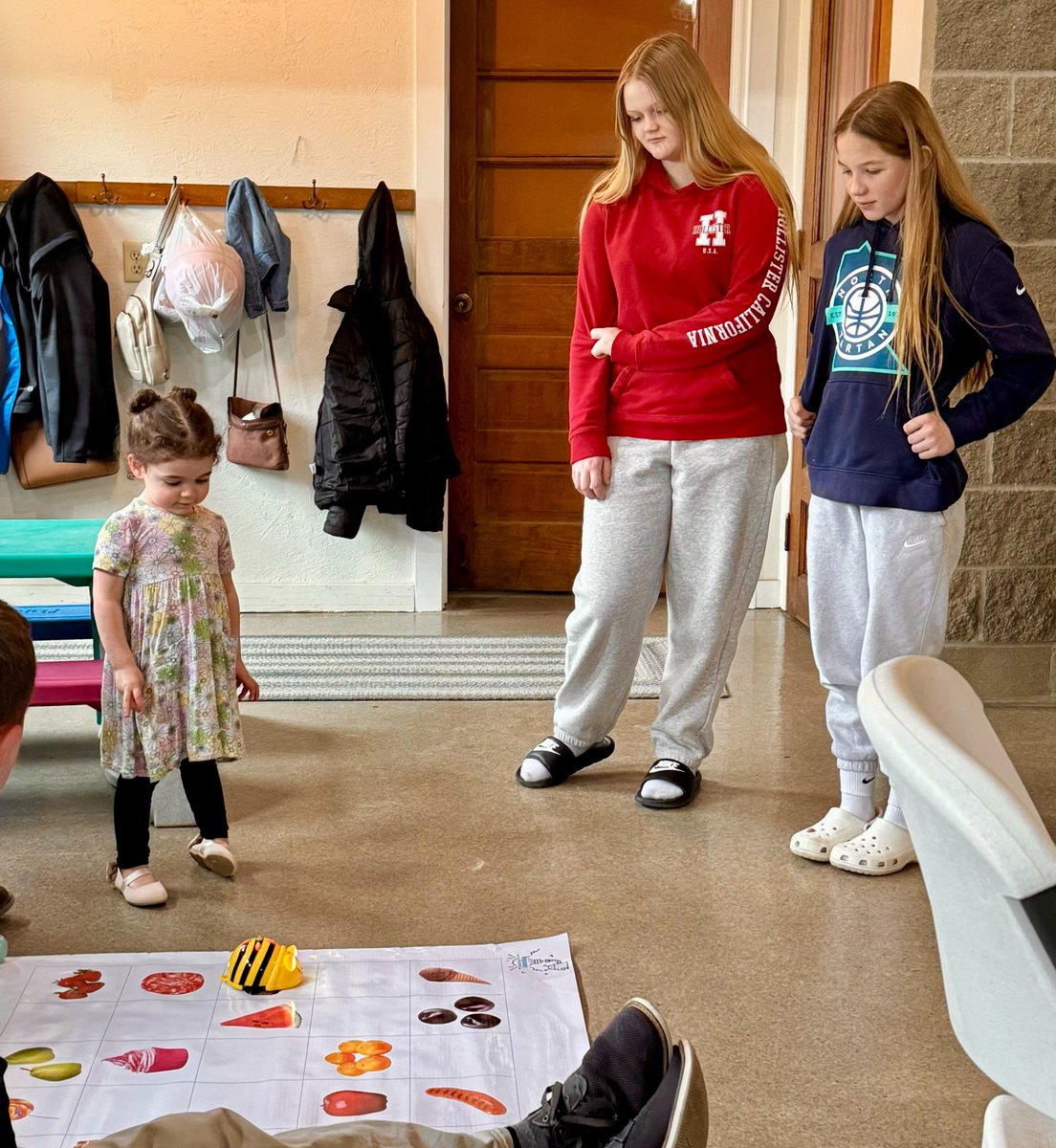 Imagine a 2-year-old stepping into a middle school room,  introducing Tale Bot Pro and BeeBot. She was excited to teach how these robots can follow simple commands to navigate mazes and tell stories. The girls realized that a young learner can grasp basics of coding through play!
