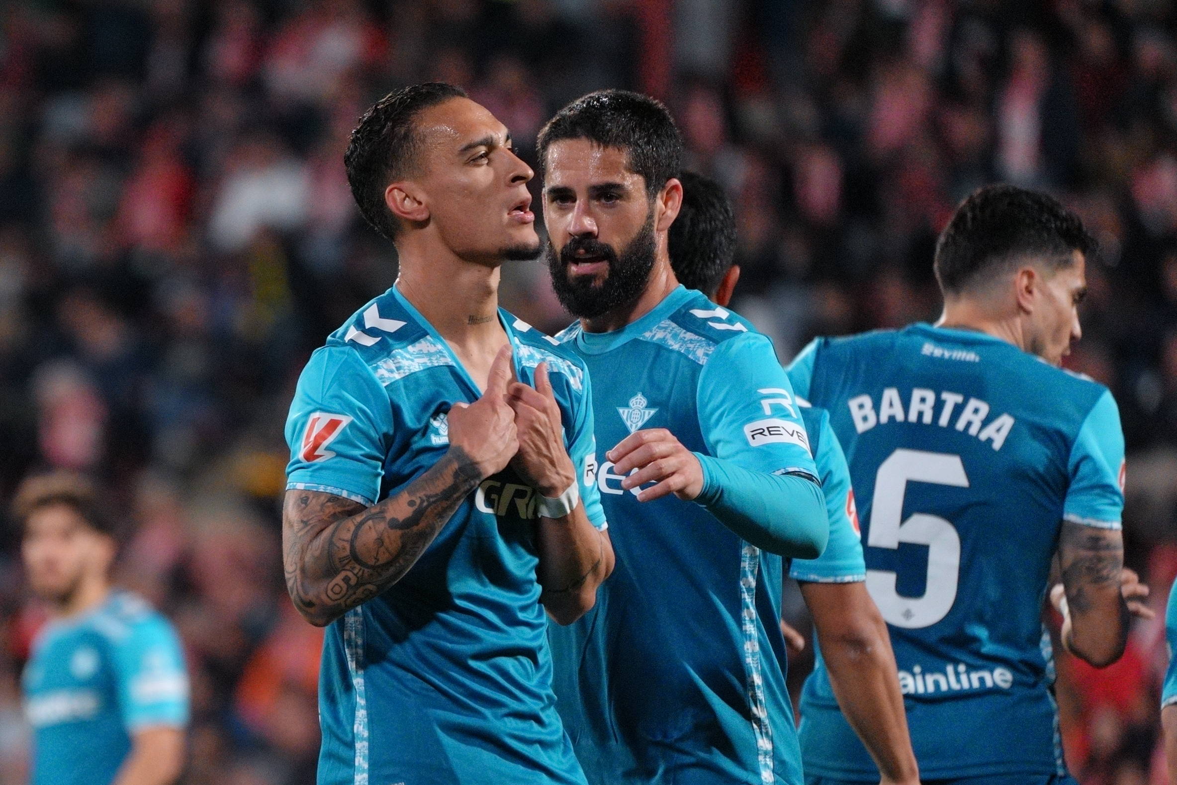 Antony and Isco celebrate against Girona