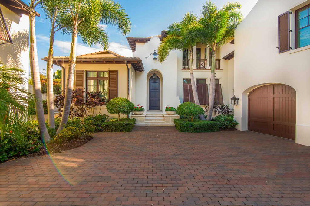 PerroneConst's tweet photo. Shadows playfully bounce off of every corner of a courtyard entrance of this Dutch West Indies-inspired estate, where the union of soft breezes and lush tropical foliage creates a serene paradise. https://t.co/smxxuPf3rm